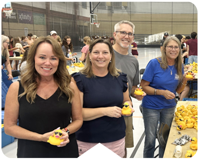 Employees volunteering at the Center for Prevention of Abuse's Annual Duck Race.