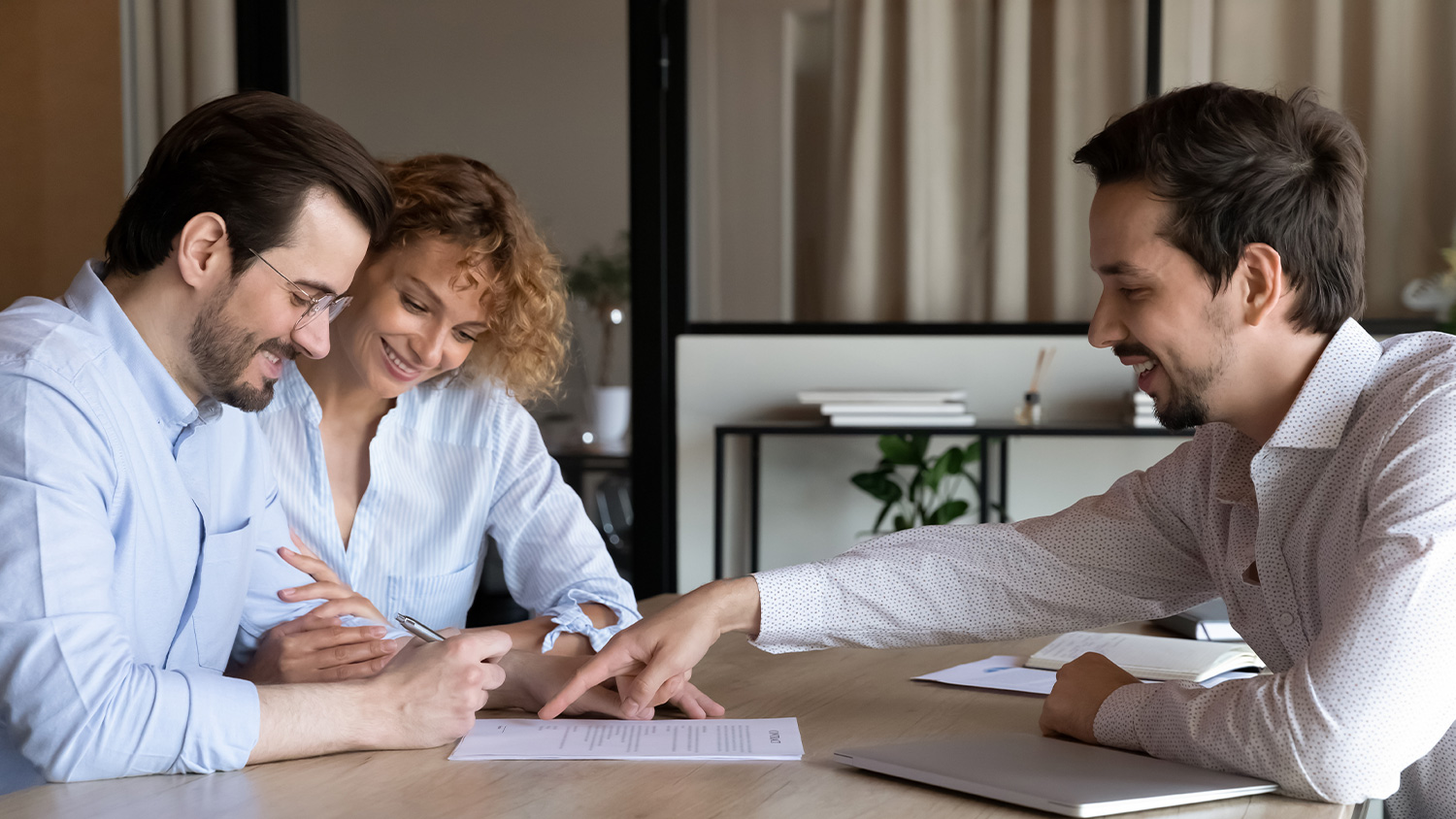 image of a couple sitting with a financial agent