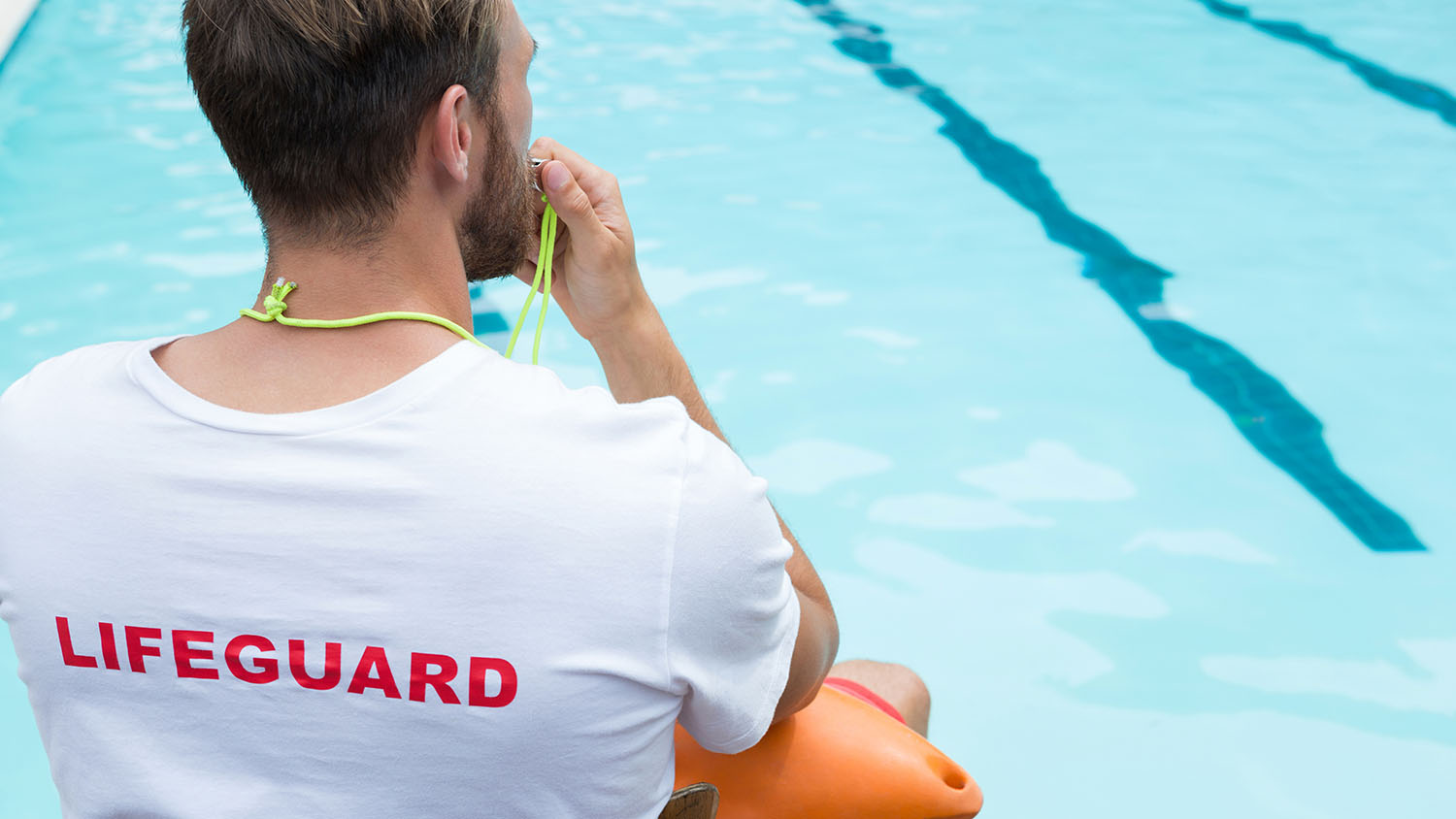 lifeguard looking over pool