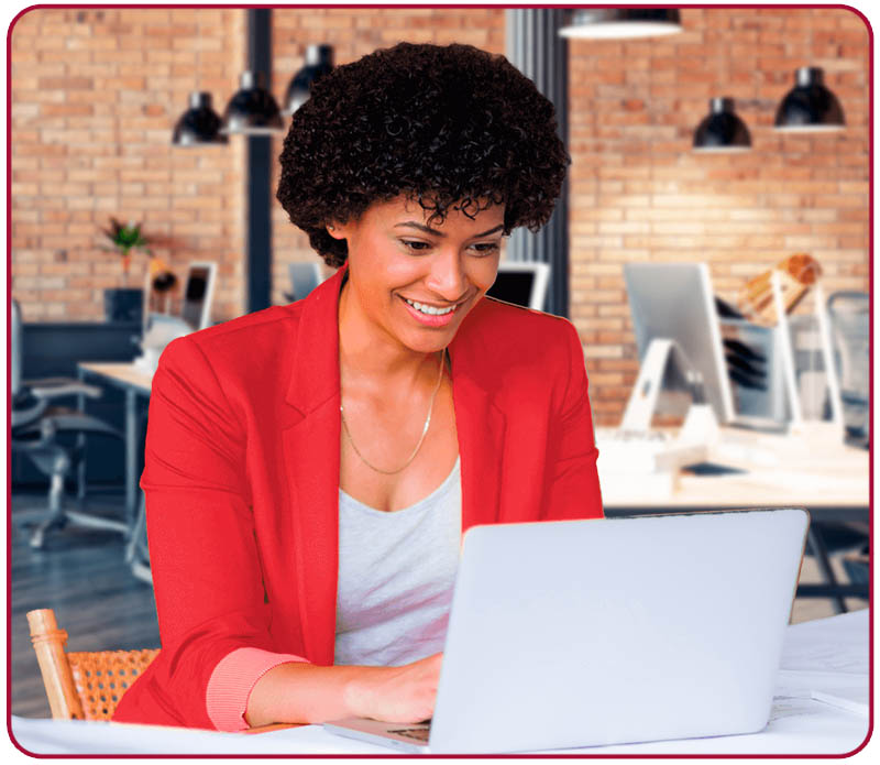 smiling businesswoman on her laptop
