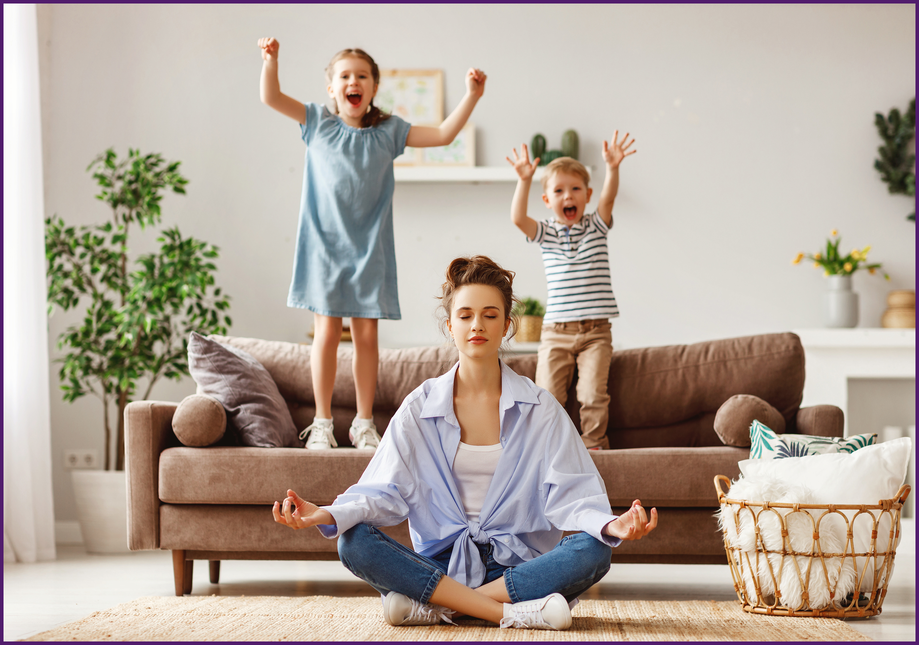 chaos-coordinator-2-OL image of a mother sitting on the floor while her two children jump on the couch