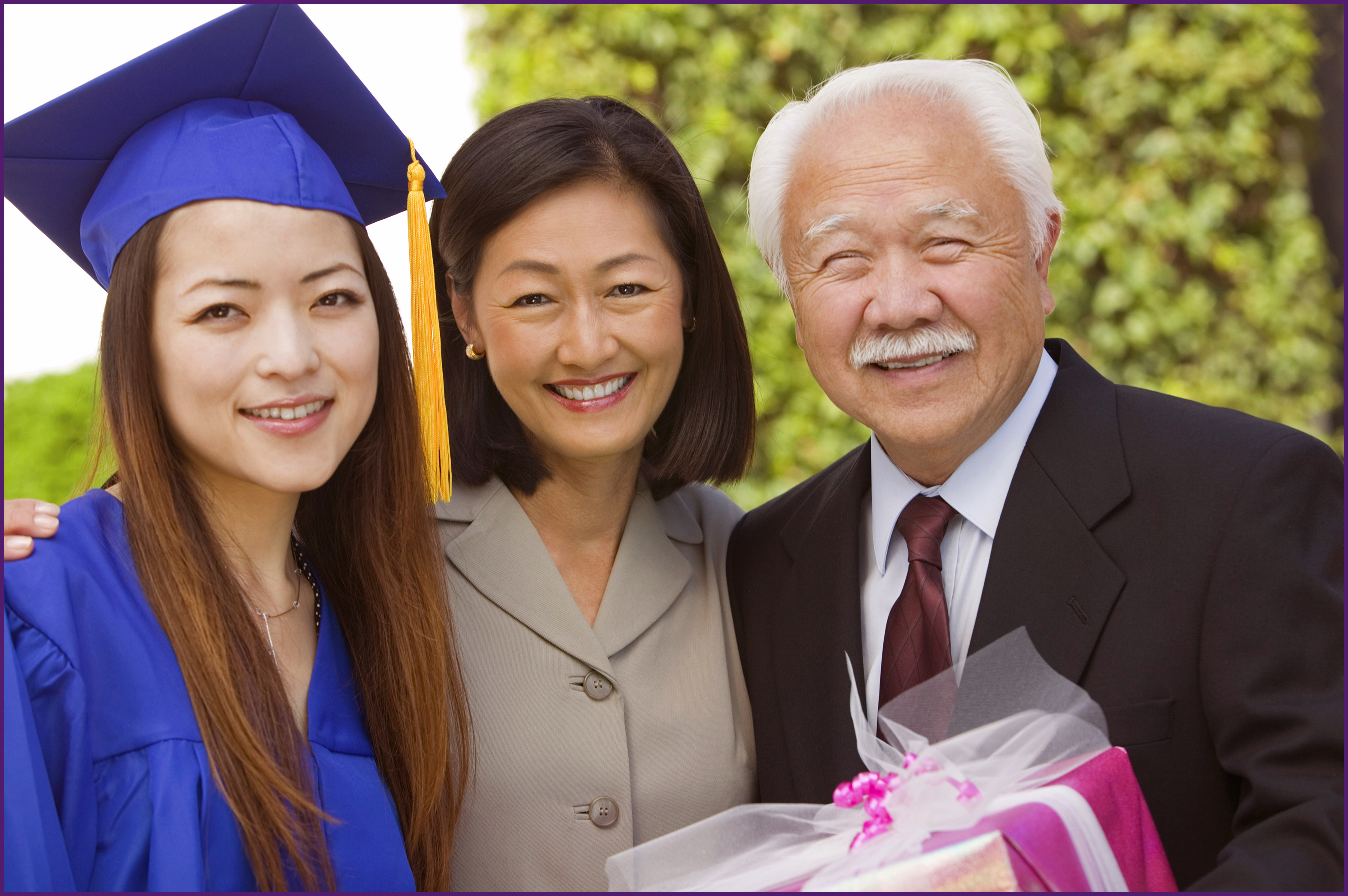 image of grandparents with the granddaughter at graduation
