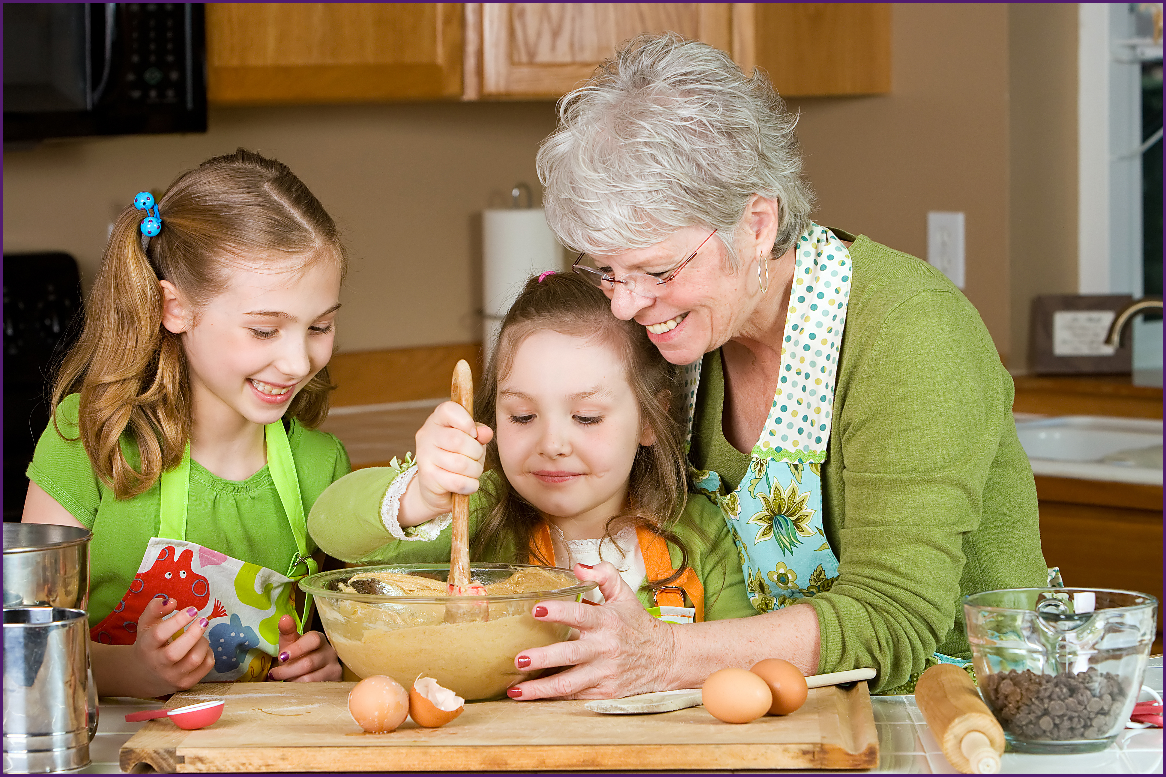 image of a grandmother teaching grandchildren how to bake