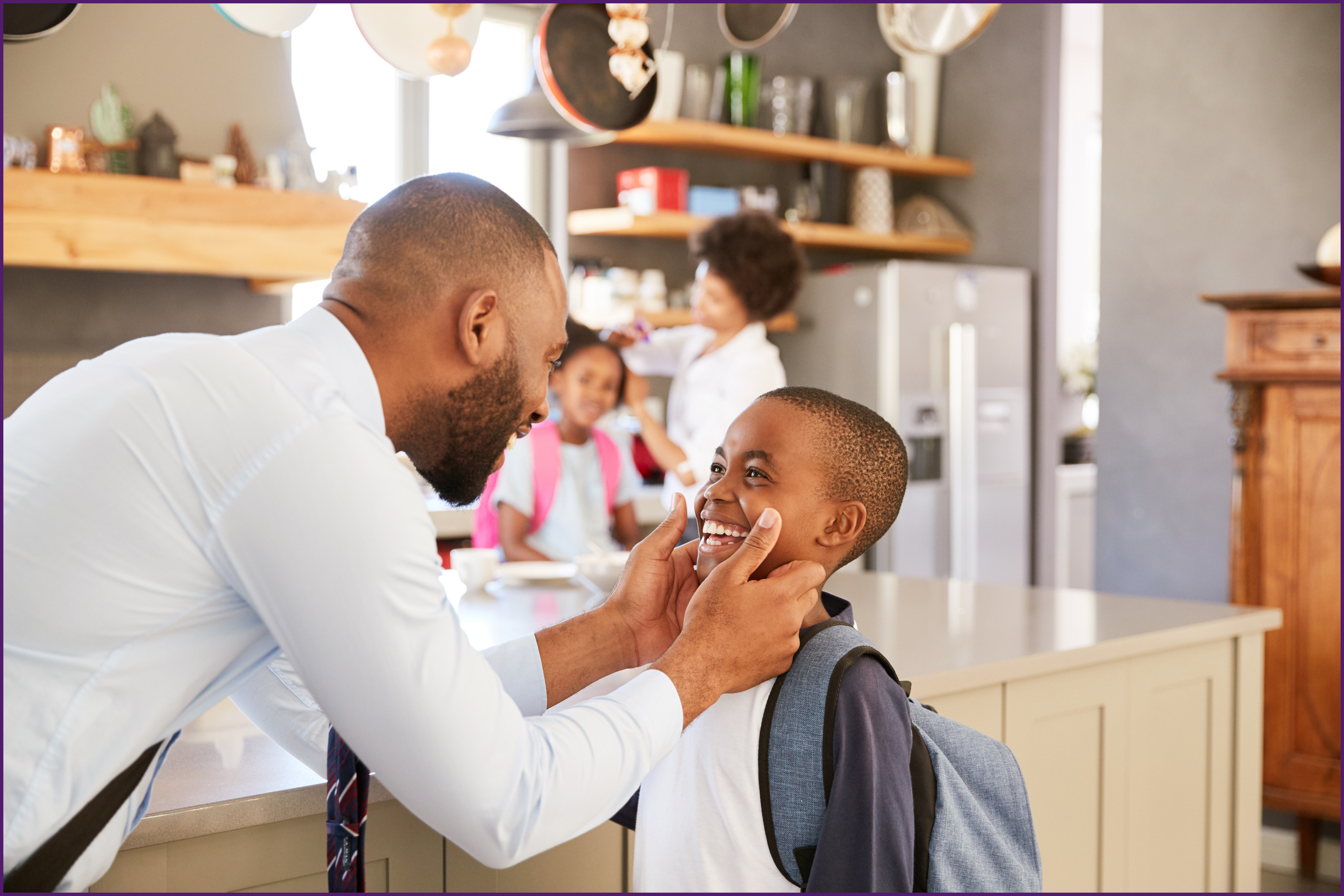 image of a father talking with his son before school