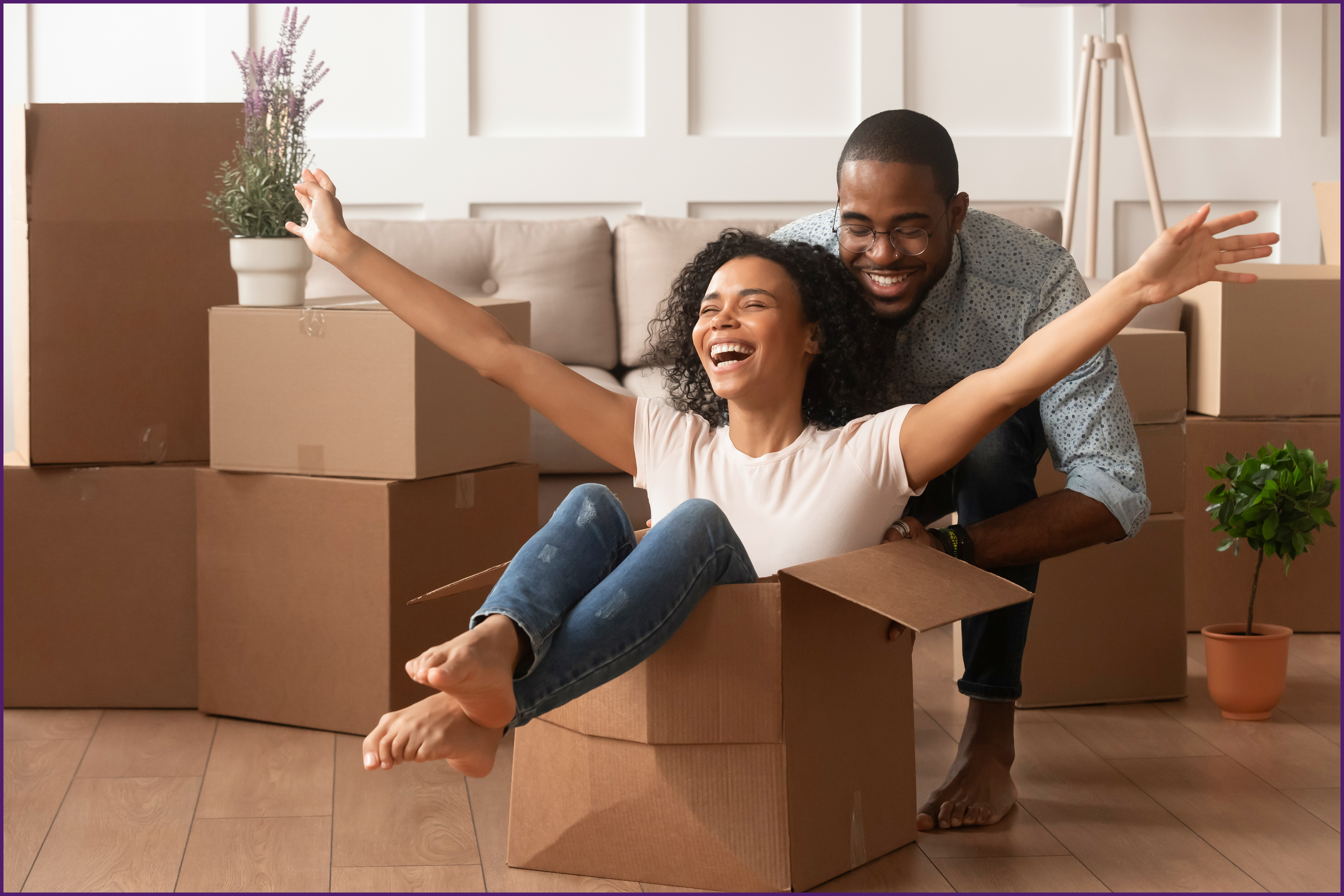 image of a couple playing with moving boxes