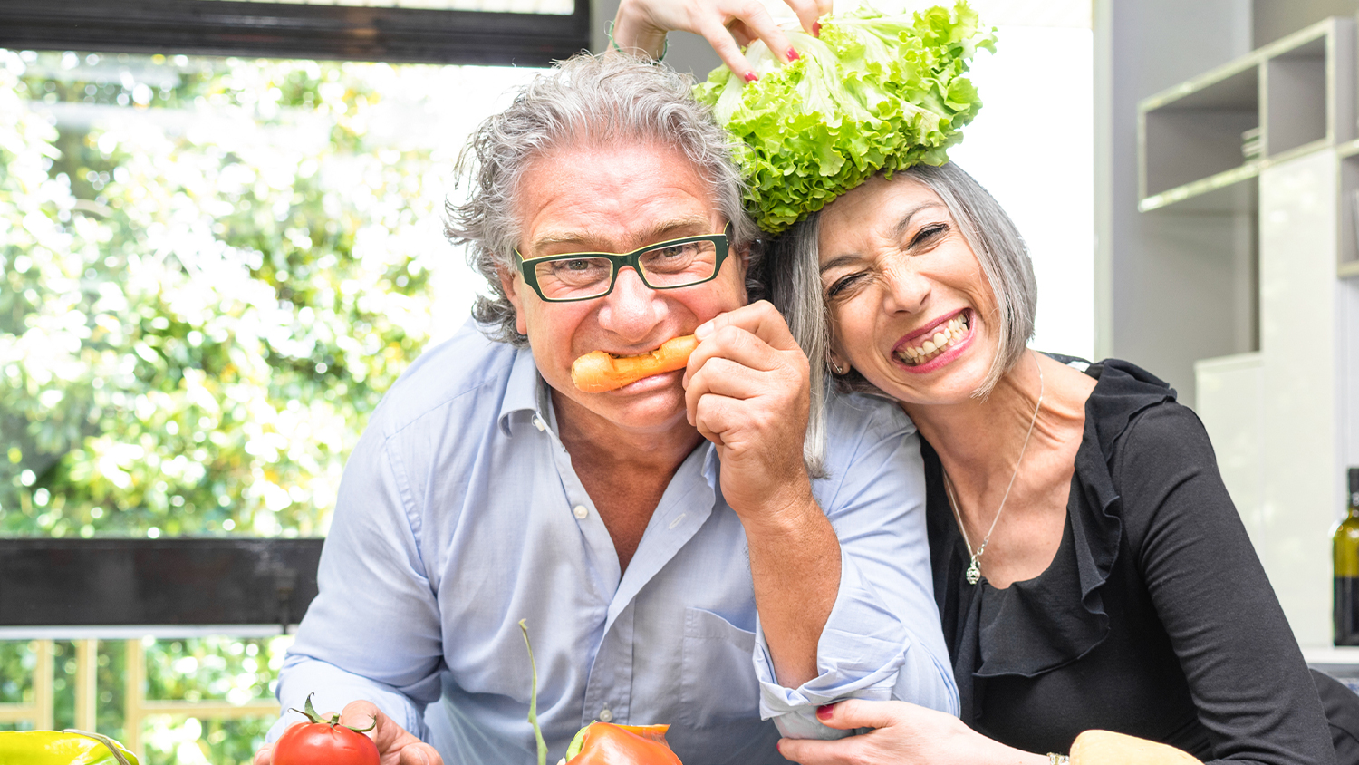 mature couple smiling in the kitchen