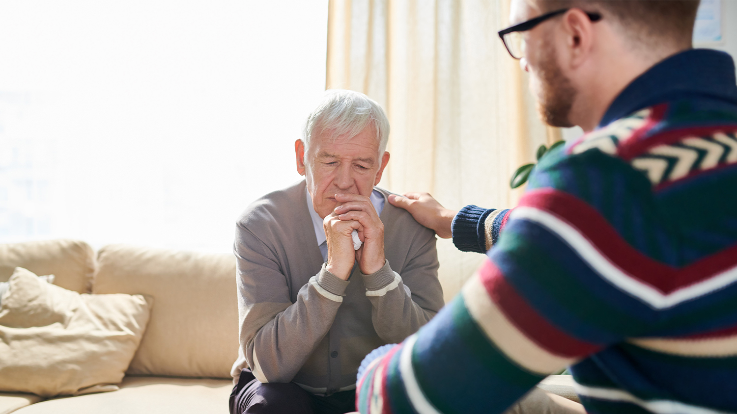 Old man grieving a lost loved one