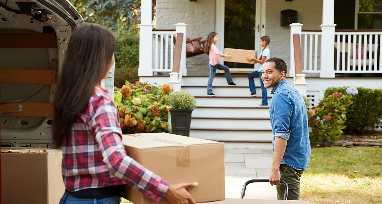 A young couple family moving into there new home