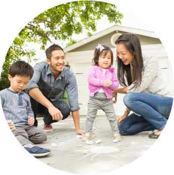 image of a family of four outside of their home