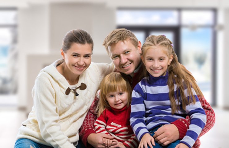 image of a young family in their home